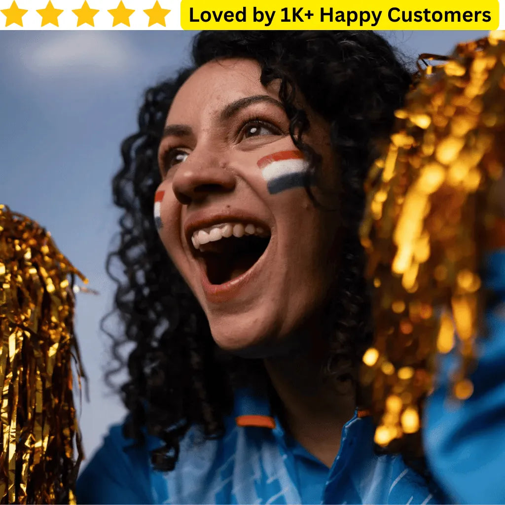 Woman with Dutch flag painted on face, surrounded by gold tinsel, with text 'Loved by 1K+ Happy Customers' above. Custom Temporary Tattoos for Kids South Africa