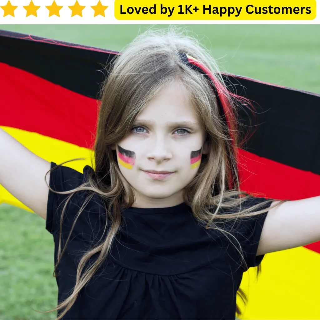 Young girl with German flag painted on her face, holding a large German flag. Springboks Tattoo – Rugby & School Team Designs! 🏉