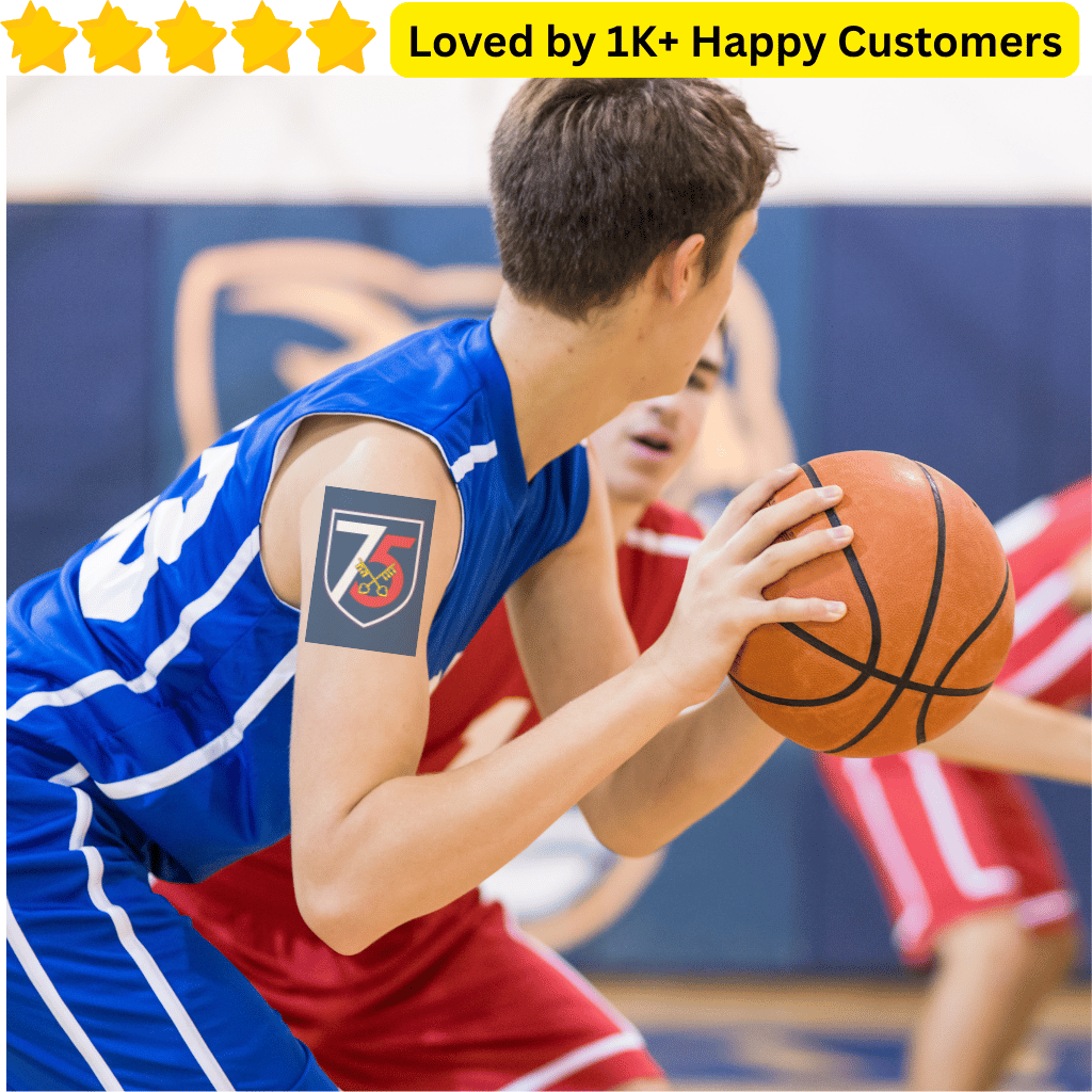 Basketball player in blue jersey with a tattoo holding a basketball, surrounded by other players in red jerseys. School Temporary Tattoos for Team Spirit