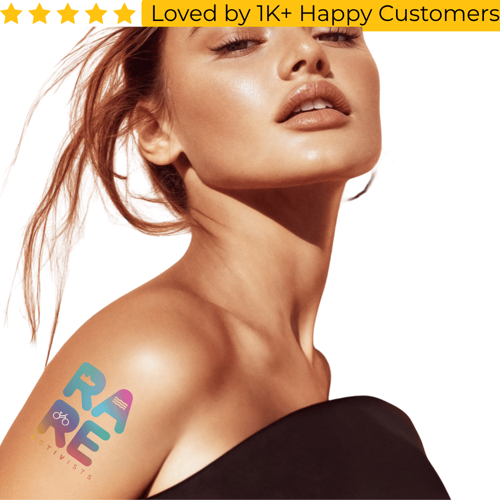 Woman with a tattoo on her shoulder and 'RARE' branding, with text 'Loved by 1K+ Happy Customers' above. Tattoo Sticker Custom – Your Design, Your Impact