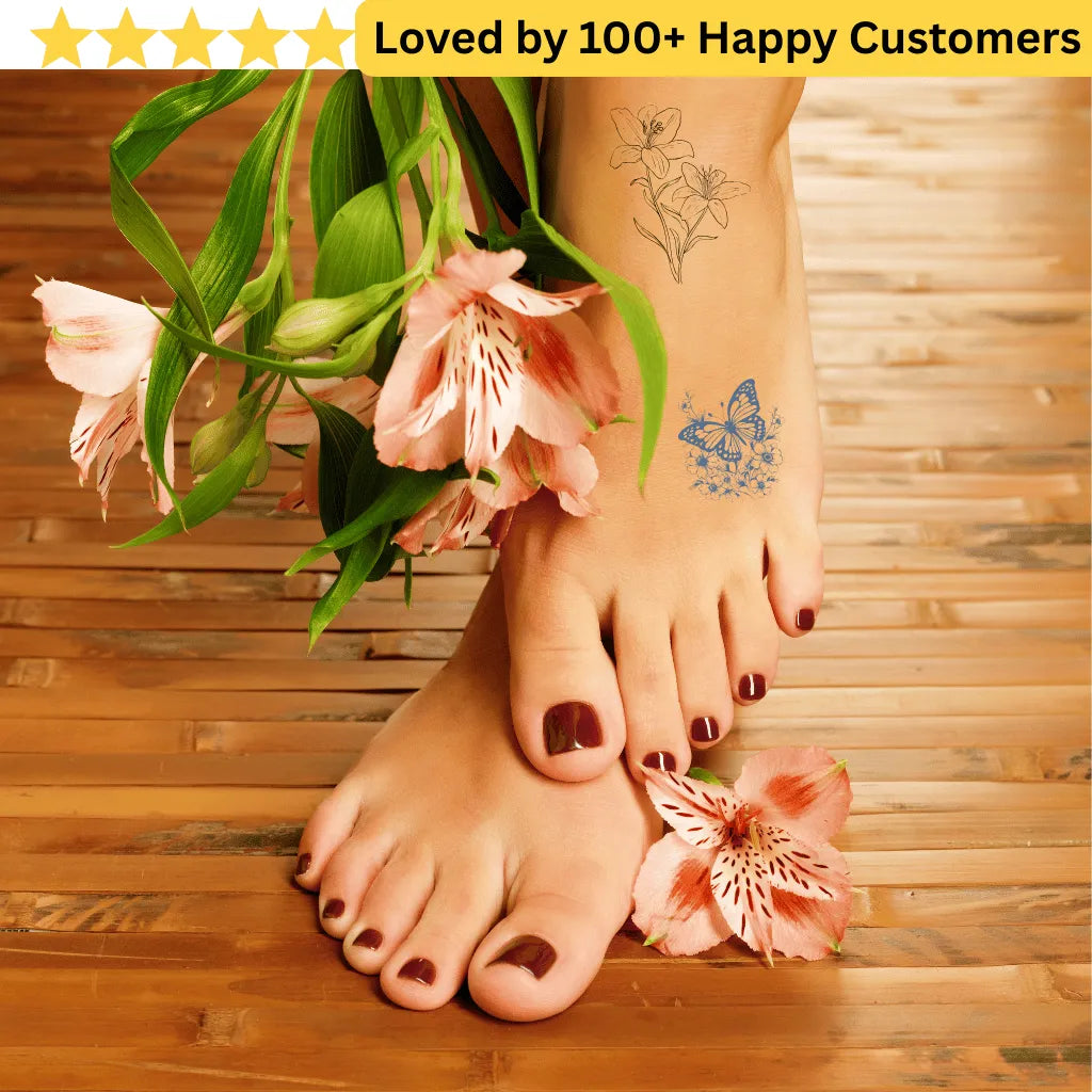 Feet with floral tattoos on a wooden background, surrounded by flowers. tattoos for ladies feet