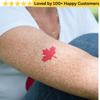 Red maple leaf tattoo on a person's arm with a blurred background. Springboks Tattoo - Print Sports Team Temporary Tattoos