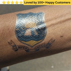 Tattoo of a shield design on a person's arm with 'Semper Integris' text, above a yellow star banner. Springboks Tattoo - Print Sports Team Temporary Tattoos