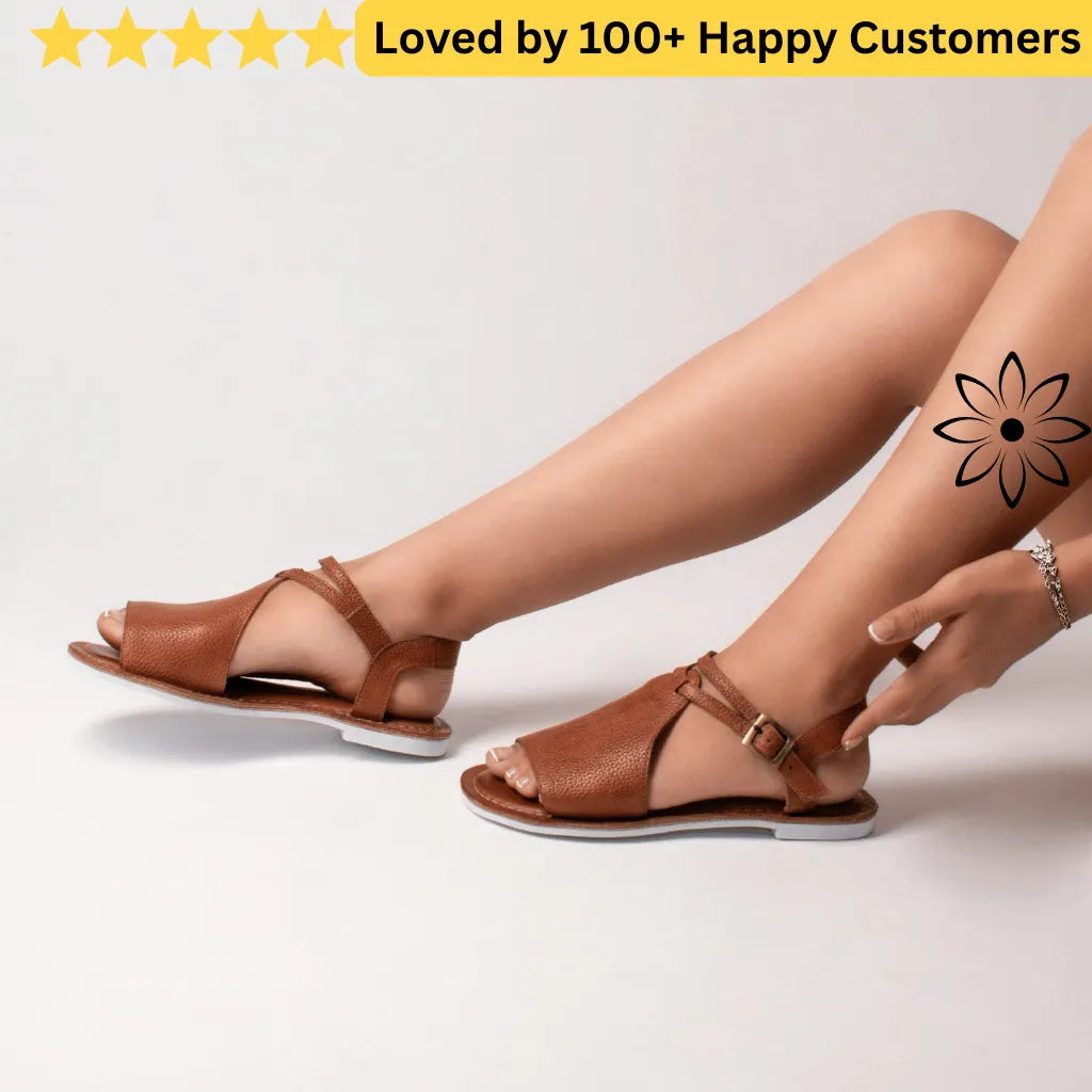 Brown sandals worn by a person on a white background with text 'Loved by 100+ Happy Customers'. Floral Tattoo Designs
