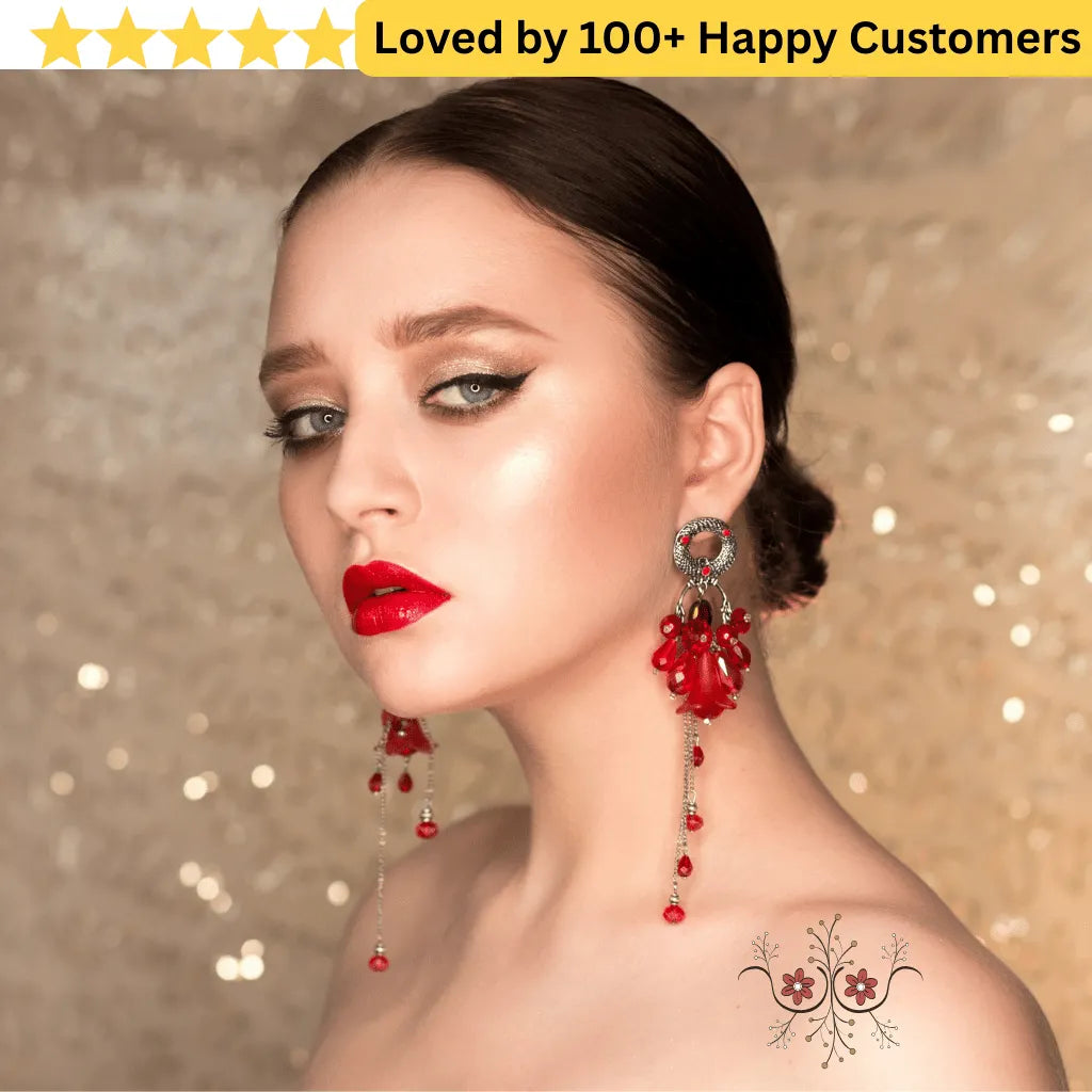 Woman wearing red earrings with a decorative background and text 'Loved by 100+ Happy Customers'. Floral Tattoo Designs