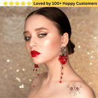 Woman wearing red earrings with a decorative background and text 'Loved by 100+ Happy Customers'. Floral Tattoo Designs