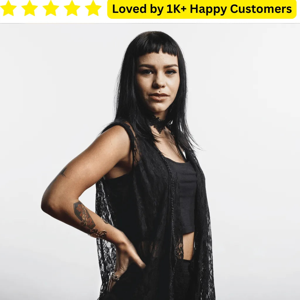 Woman wearing a black outfit with sheer details on a white background, with text 'Loved by 1K+ Happy Customers' above. Goth Tattoo – Upload Your Artwork & Get in 3 Days