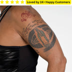 Person with tattoos on their arm, wearing a black top, with text 'Loved by 1K+ Happy Customers' at the top. Goth Tattoo – Upload Your Artwork & Get in 3 Days