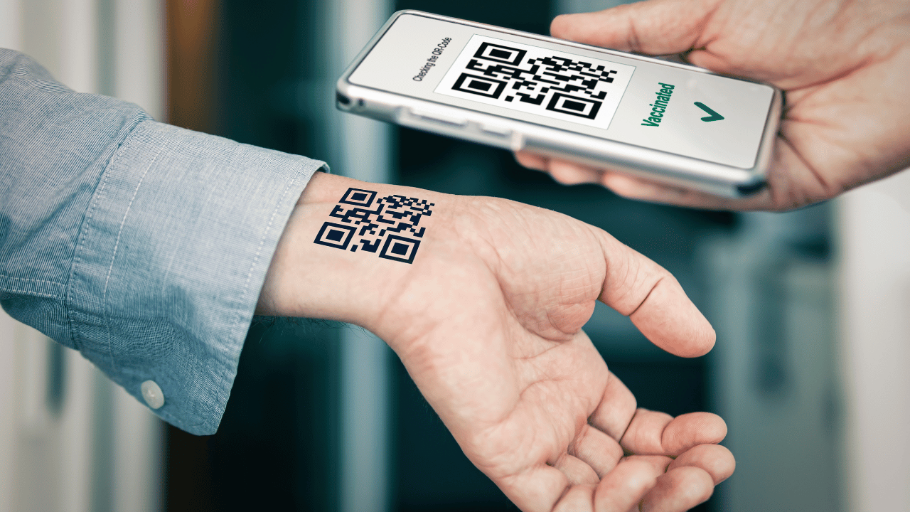 Person holding a smartphone with a QR code on a blurred background. Spark Interest with Custom Temporary Tattoos!