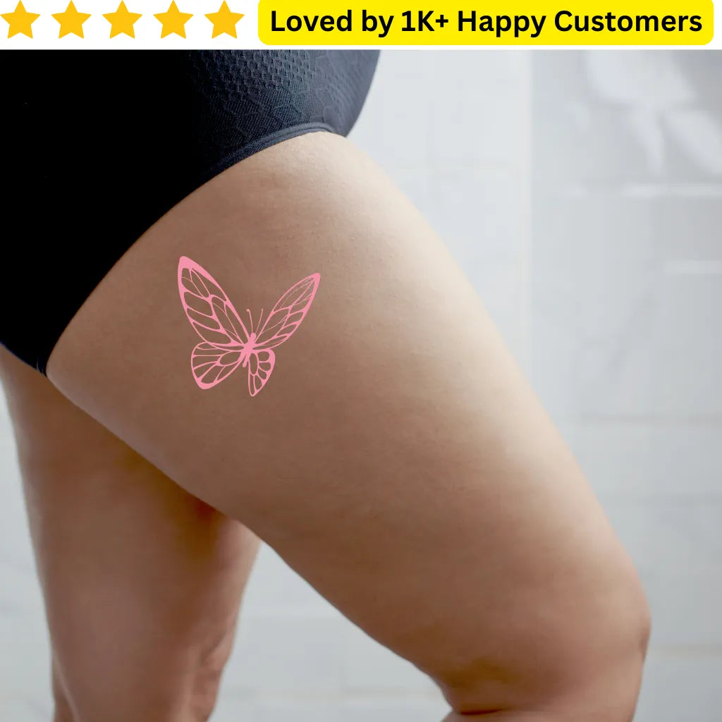 Pink butterfly tattoo on a person's leg with a white background. For Women Tattoos- Discover Elegant & Meaningful