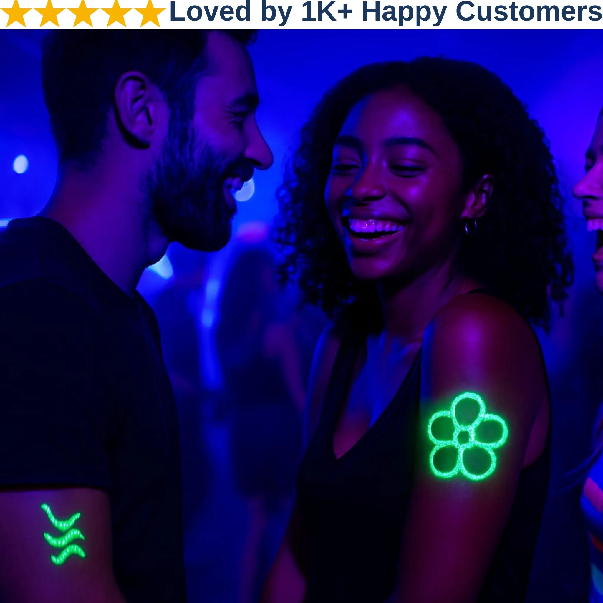 Two people with UV reactive tattoos on a dark background with blue lighting. Glow in the Dark Tattoos 