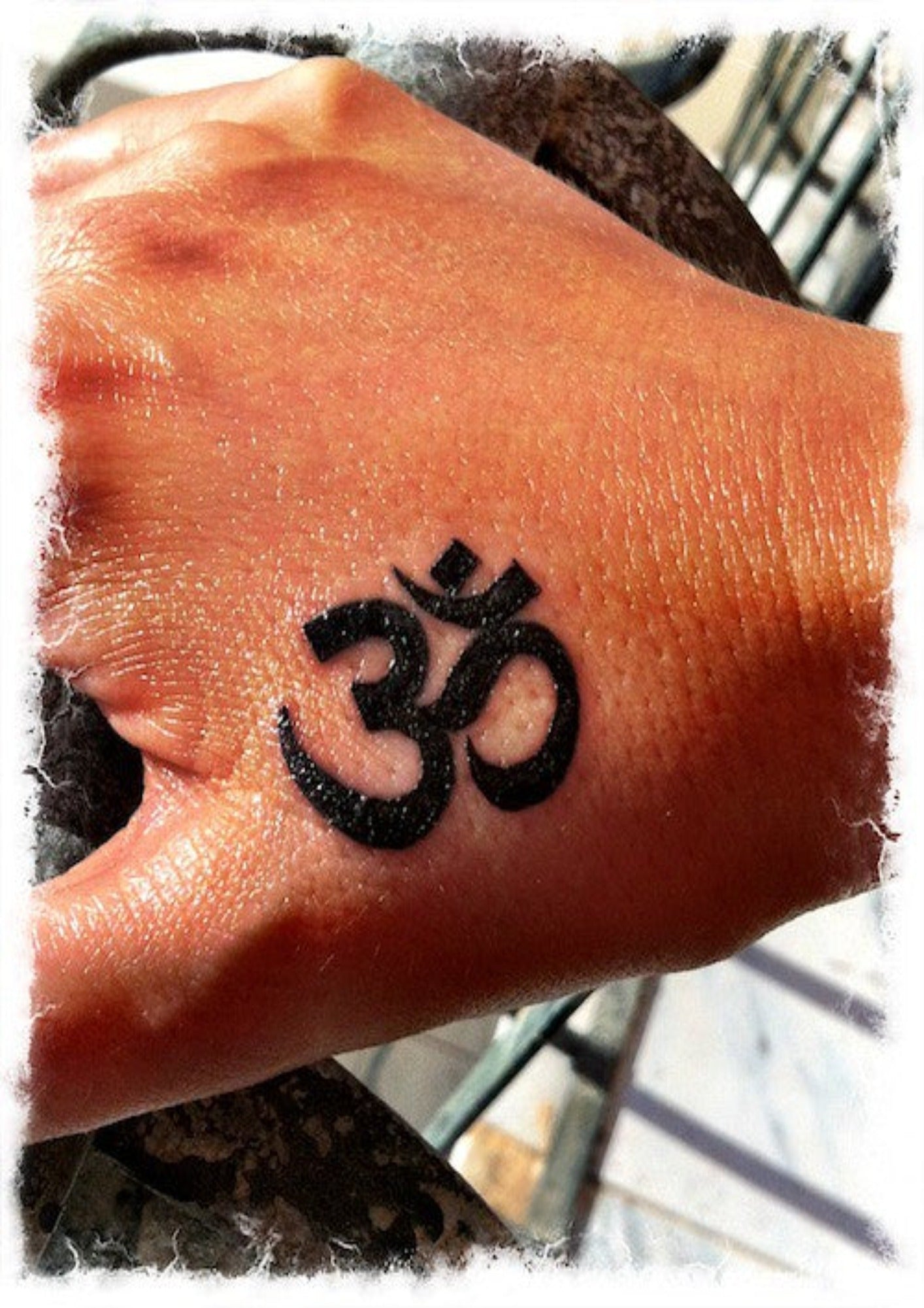 OM Symbol Tattoo on Hand