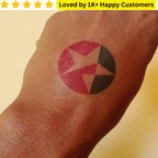 Tattoo of a circular design on a wrist with a yellow banner at the top Custom Tattoo – Your Design, Your Statement 🎨