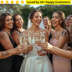 Bride with bridesmaids holding champagne glasses, surrounded by text 'Loved by 1K+ Happy Customers'. Custom Non-Permanent Tattoos Near Me printed in South Africa—wear your design before you commit