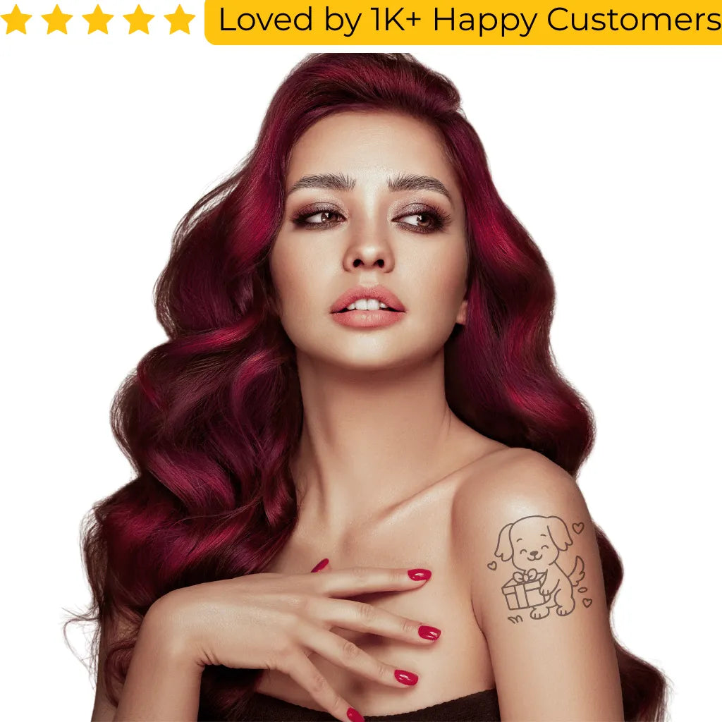 Woman with vibrant red hair and a tattoo of a dog holding a gift box on a white background. Shop Online for Fake Tattoos South Africa’s Best Tattoo Designs