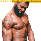 Muscular man with a tiger tattoo on his arm, with text 'Loved by 1K+ Happy Customers' above. Shop Online for Fake Tattoos South Africa’s Best Tattoo Designs