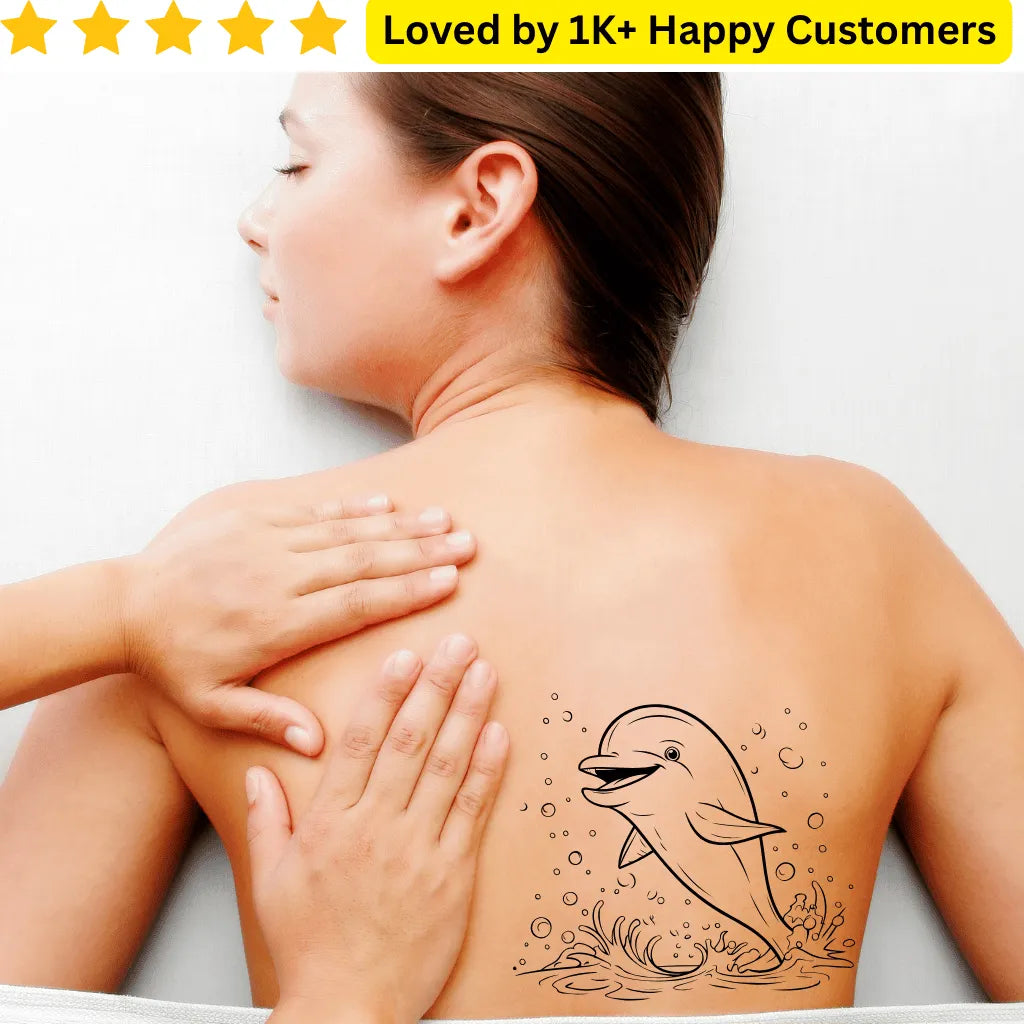 Person with a dolphin tattoo on their back, receiving a massage. Expressive Tattoos for Ladies Back - Love Style Without the Commitment