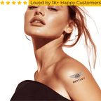 Woman with Bentley logo tattoo on shoulder against a white background. Tattoo Sticker Custom – Your Design, Your Impact