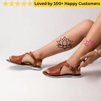 Brown sandals worn by a person with temporary tattoos of lotus flowers on a light background. Elegant Flower Tattoo Lotus for Inner Peace
