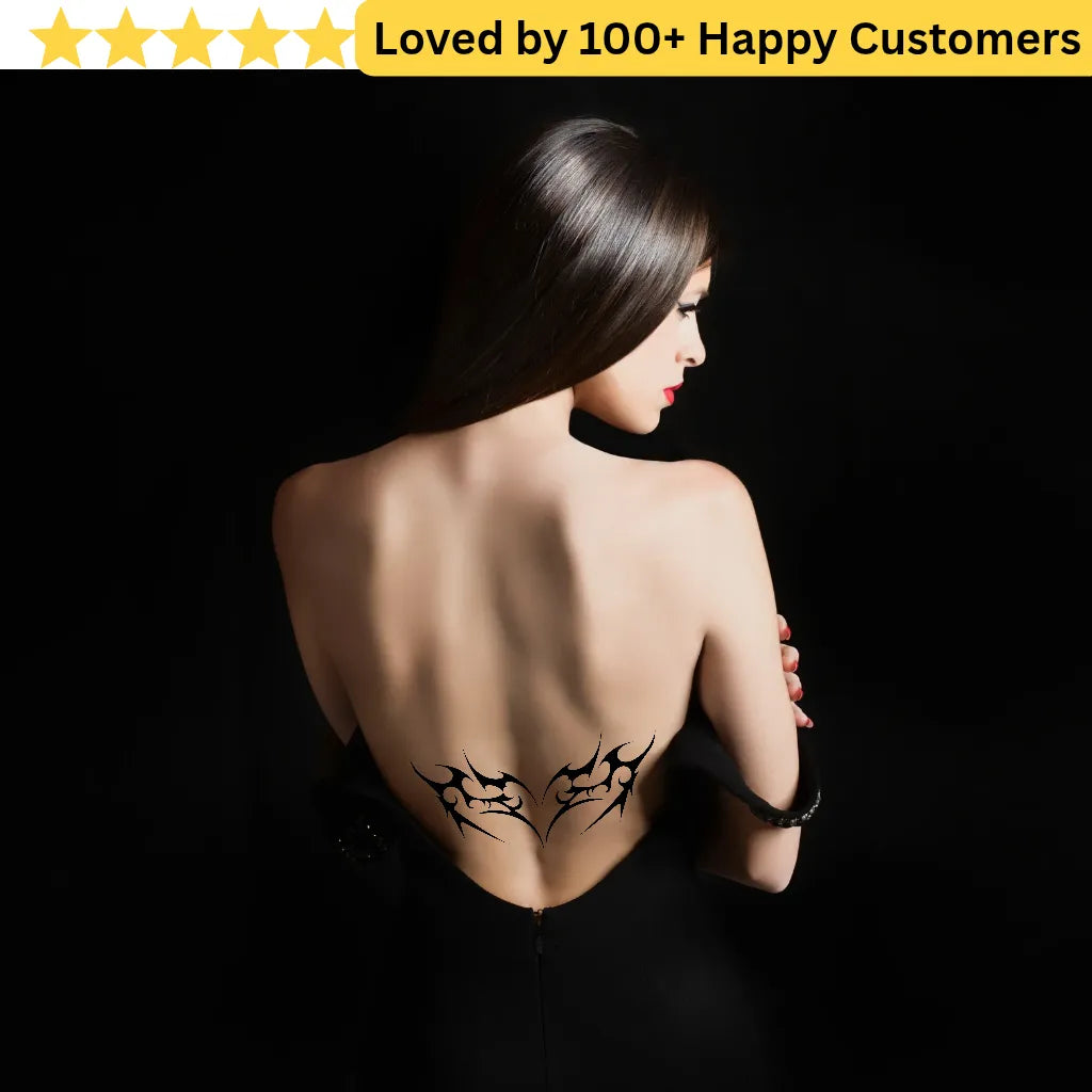 Woman with a back tattoo on a black background, surrounded by text 'Loved by 100+ Happy Customers'. Lower Back Tattoos Womens – Feminine & Flirty
