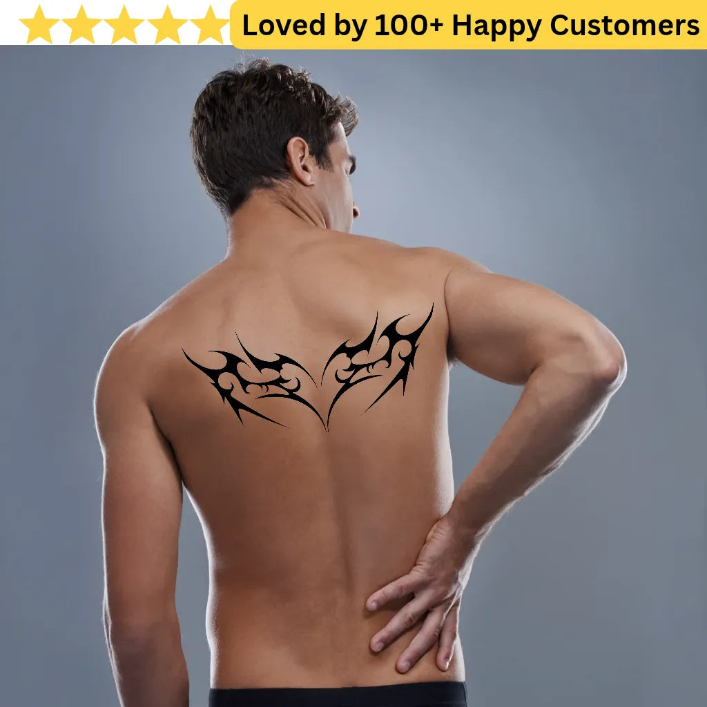 Man with tribal tattoo on back against a gray background, with text 'Loved by 100+ Happy Customers' at the top. Lower Back Tattoos Womens – Feminine & Flirty