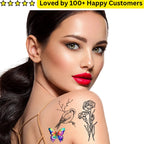 Woman with temporary tattoos of a butterfly, bird, and flower on her shoulder against a white background.