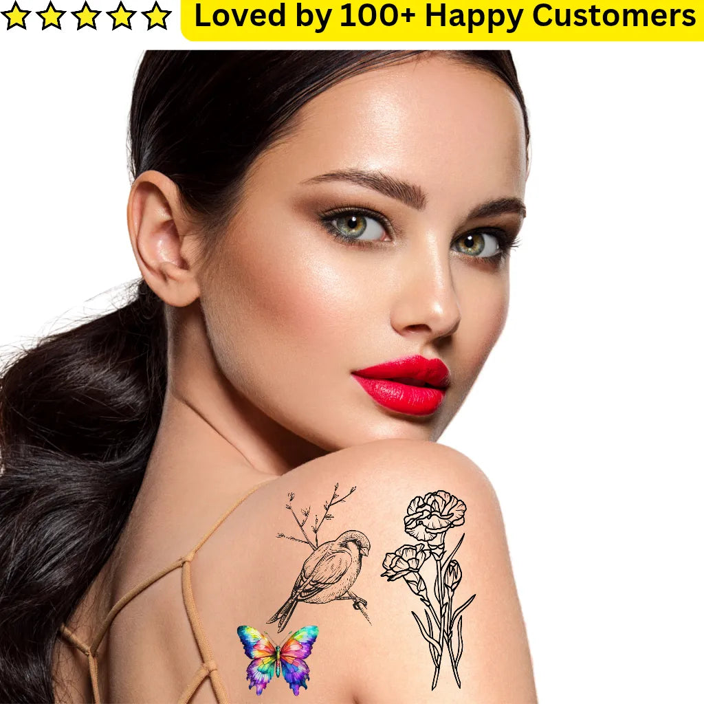 Woman with temporary tattoos of a butterfly, bird, and flower on her shoulder against a white background.