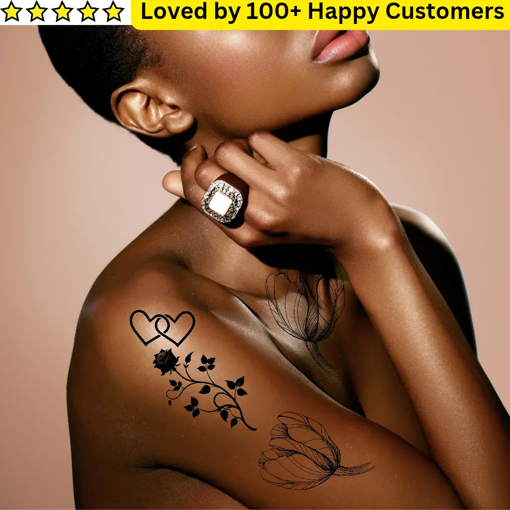 Woman with floral tattoos on her arm against a beige background