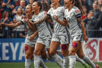 Group of female soccer players celebrating on a field with a crowd in the background. 🌟 Elevate fashion using Customized Tattoo Sticker Online South Africa