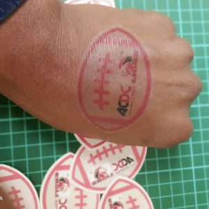 Hand with a red stamp on a green grid background