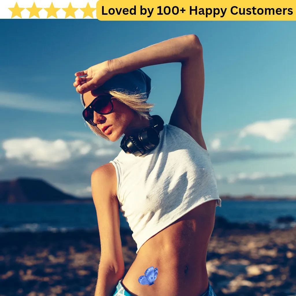 Woman with sunglasses and headphones against a scenic background, with text 'Loved by 100+ Happy Customers'. Women Lower Back Tattoos – Sensual & Temporary Art