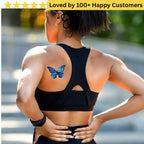 Person wearing a black sports bra with a butterfly tattoo outdoors. Women Lower Back Tattoos – Sensual & Temporary Art